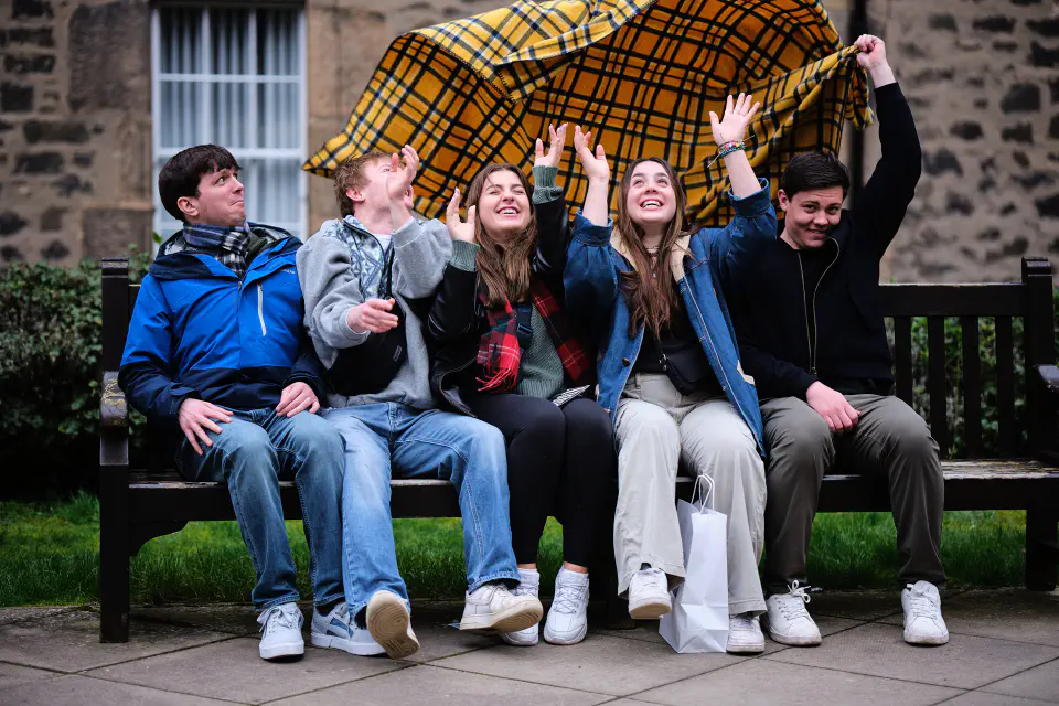 Students sitting on a bench